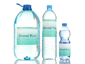Wrap-around labeling for mineral water bottles